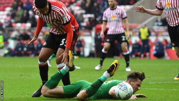 Jake Clarke-Salter hauls down Alan Browne and gets a second booking