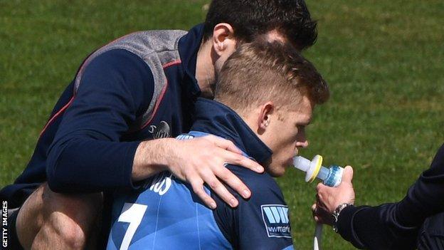 Sam Billings receiving oxygen