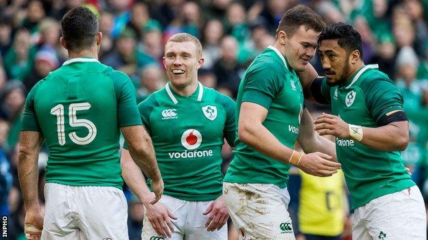 Stockdale is congratulated by Rob Kearney (15), Earls and Bundee Aki (right) after one of his two tries against Italy