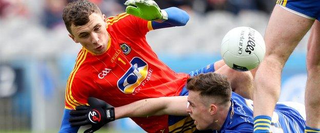 Rossies keeper James Featherston denies Cavan forward Dara McVeety in the Croker final