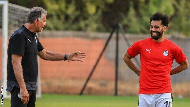 Egypt coach Carlos Queiroz (left) talks to striker Mohamed Salah