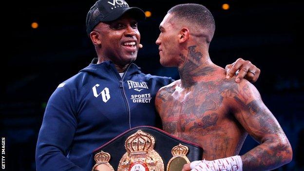 Nigel Benn and Conor Benn share a moment in the ring