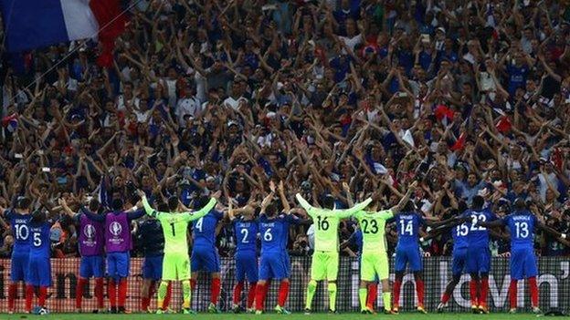 France's players celebrate their semi-final win with their fans