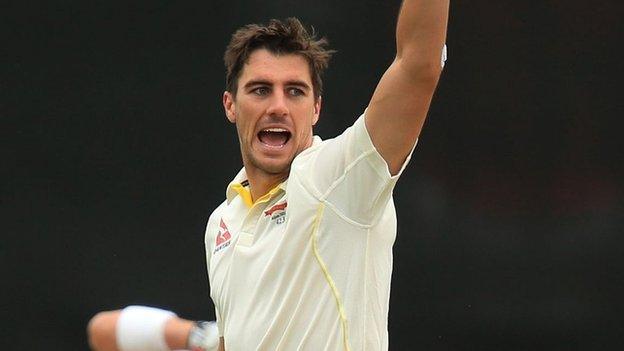 Pat Cummins celebrates the wicket of Hamish Rutherford