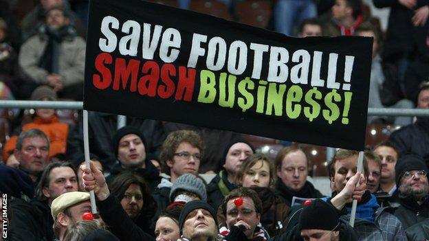 St Pauli fans display a banner reading: Save Football Smash Busine$$