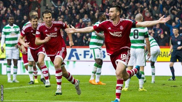 Paul Quinn celebrates his late winner for Aberdeen