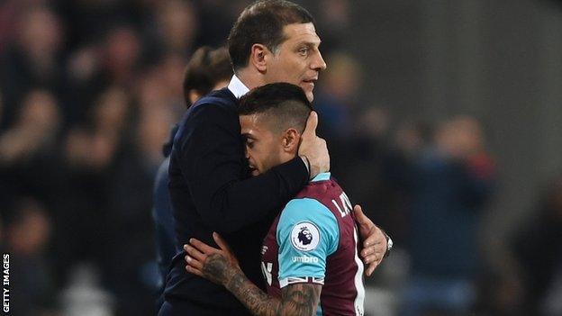 Manuel Lanzini celebrates West Ham's win with boss Slaven Bilic