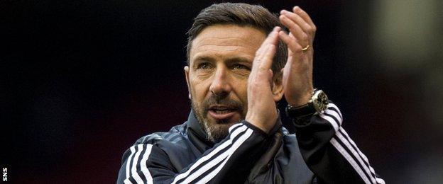 Aberdeen manager Derek McInnes applauds fans after the win over Kilmarnock