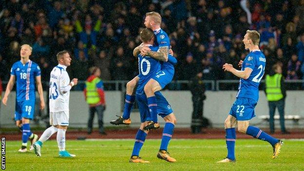 Gylfi Sigurdsson celebrates an Iceland goal on the night they secured qualification