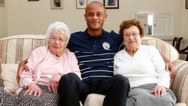 Man City's mascots with Vincent Kompany