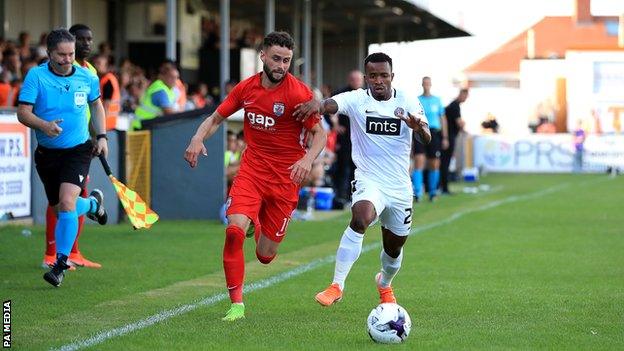 Connah"s Quay Nomads' Nathan Woolfe (left) and Partizan Belgrade's Seydouba Soumah battle for the ball