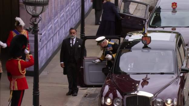 King Charles III, Prince William and Prince Harry enter Westminster Hall ahead of the procession