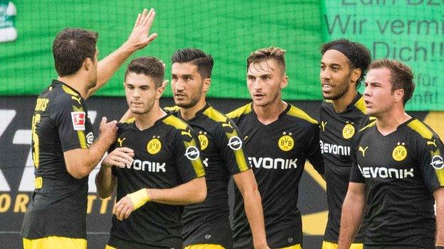 Dortmund players celebrate Christian Pulisic's opening goal