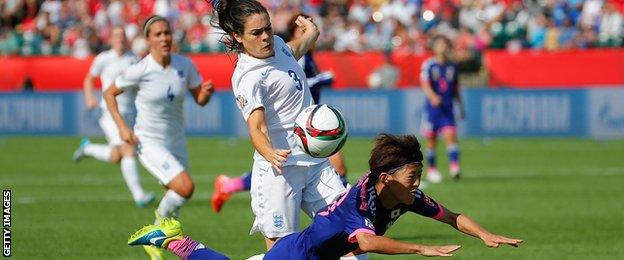 Claire Rafferty of England fouls Saori Ariyoshi of Japan to concede a penalty