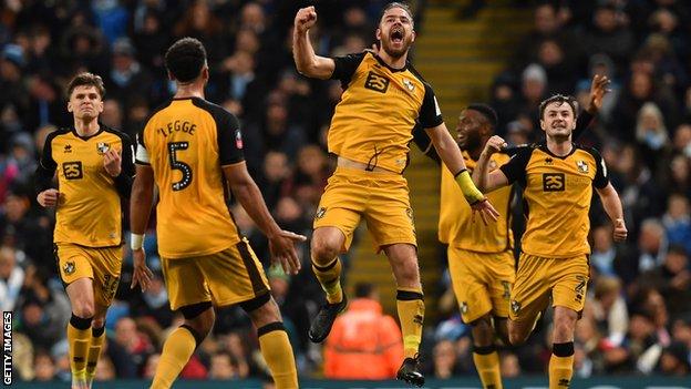 Tom Pope headed Port Vale level before Sergio Aguero put Manchester City 2-1 up