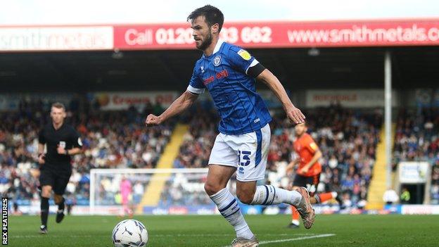 Jimmy Keohane plays for Rochdale during the team's defeat at home to Oldham in September