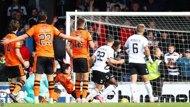 Tomi Adeloye (partially hidden) scores to make it 1-0 Ayr United