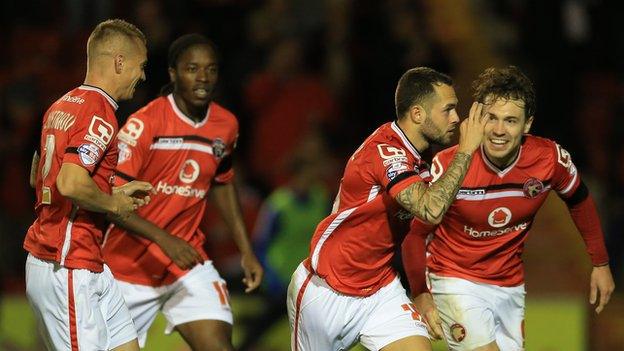 Walsall players celebrate Milan Lalkovic's equaliser in the League Cup win over Brighton