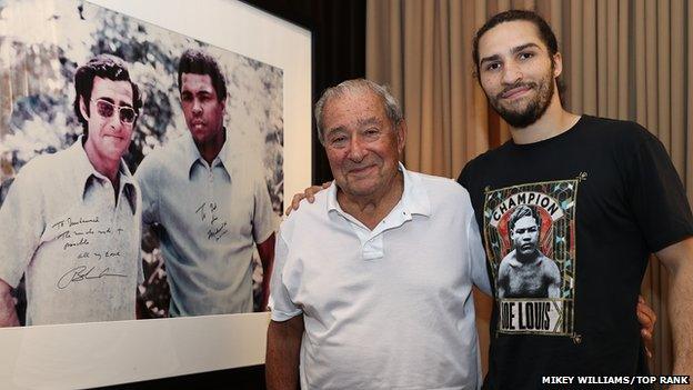 Ali Walsh with Bob Arum next to the photograph that hangs in the promoter's office