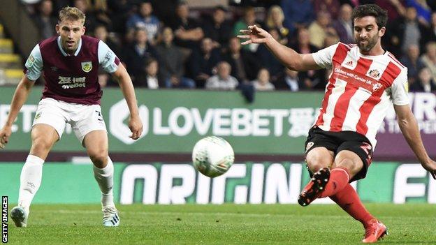 Will Grigg (right) scores for Sunderland