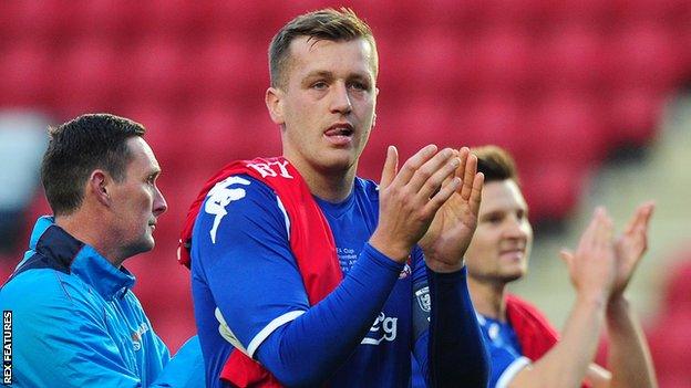 Ben Gerring applauds Truro City's fans after their FA Cup loss at Charlton Athletic