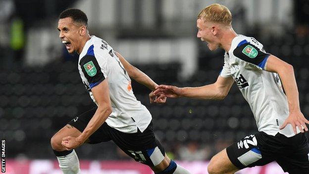 Ravel Morrison celebrates scoring for Derby County against Salford City