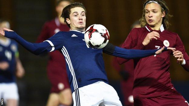 Scott Wright controls the ball for Scotland Under-21s against Latvia