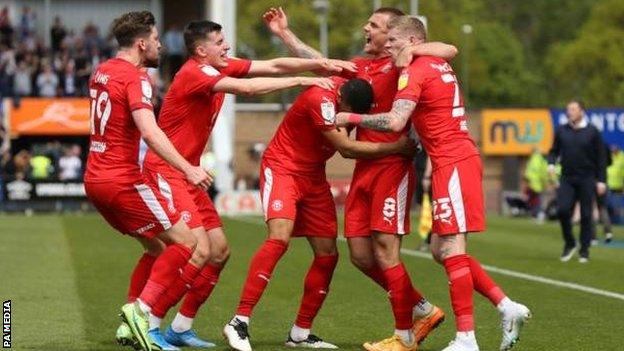 Wigan Athletic players celebrate Max Power's first-half goal against Shrewsbury