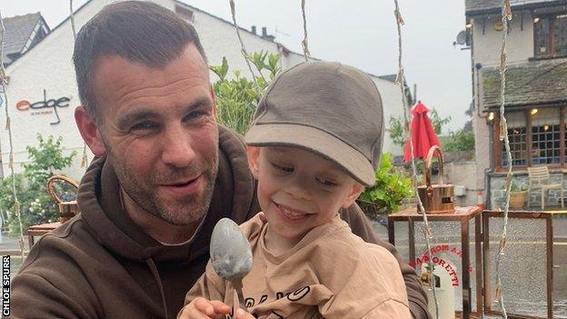 Former professional footballer Tommy Spurr and his three-year-old son Rio