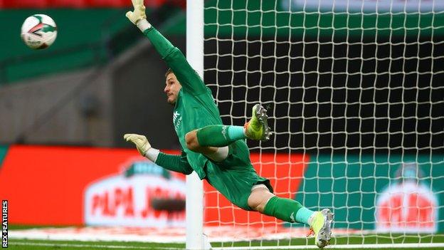 Salford City goalkeeper Vaclav Hladky saves Ronan Curtis' penalty