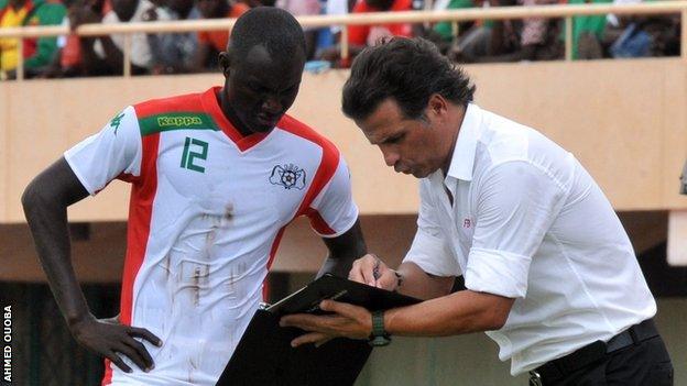 Midfielder Adama Guira with coach Paulo Duarte