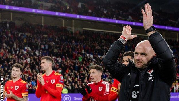 Robert Page applauds the fans after Wales secured a play-off