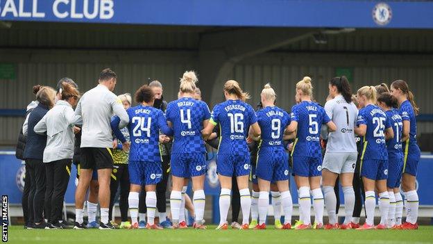 Chelsea players and coaches link arms