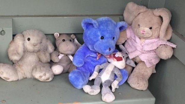 Cuddly toys at bus stop