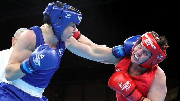 Rosie Eccles and Eireann Nugent exchange punches in their semi-final at the NEC Arena