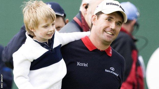 Padraig Harrington shares a moment with son Paddy after holing out at the 18th