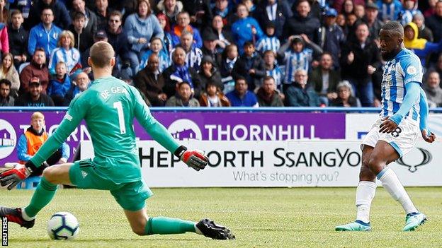 Isaac Mbenza scores for Huddersfield against Manchester United in the Premier League