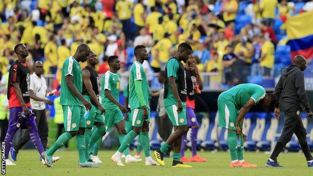 Senegal players exit the pitch