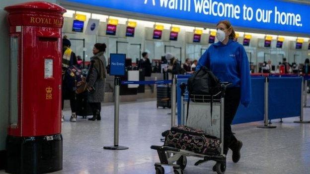 Woman travelling through Heathrow