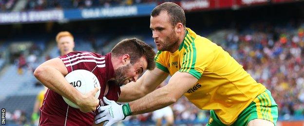 Donegal defender Neil McGee challenges Galway's Paul Conroy