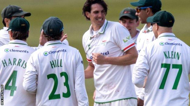 Chris Wright and his Leicestershire team-mates celebrate the wicket of Kraigg Brathwaite