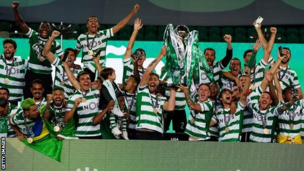 Sporting Lisbon's players celebrate winning the Portuguese League