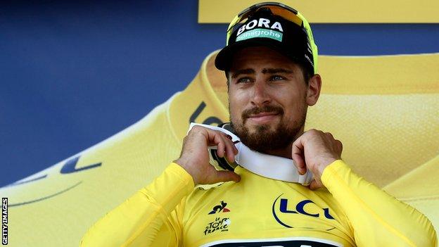 Peter Sagan pulls on the yellow jersey