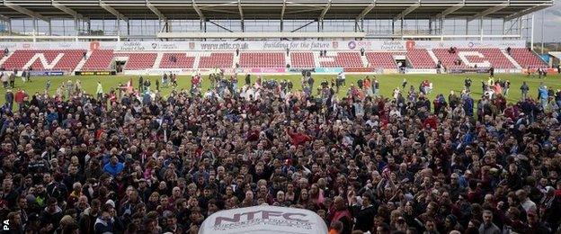 Northampton fans ran onto the pitch at the final whistle