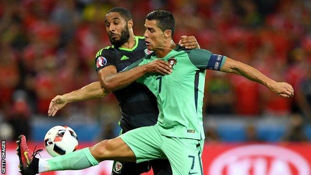 Ashley Williams in action against Cristiano Ronaldo