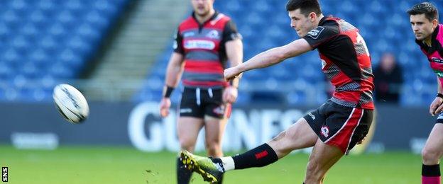 Blair Kinghorn kicks at goal for Edinburgh against Scarlets