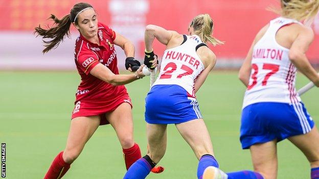 Belgium's Tiphaine Duquesne and Britain's Jo Hunter fight for the ball