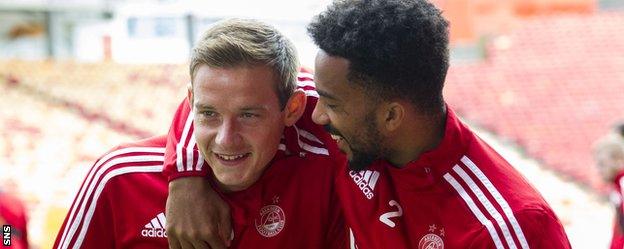 Aberdeen's Peter Pawlett and Shay Logan joke in training