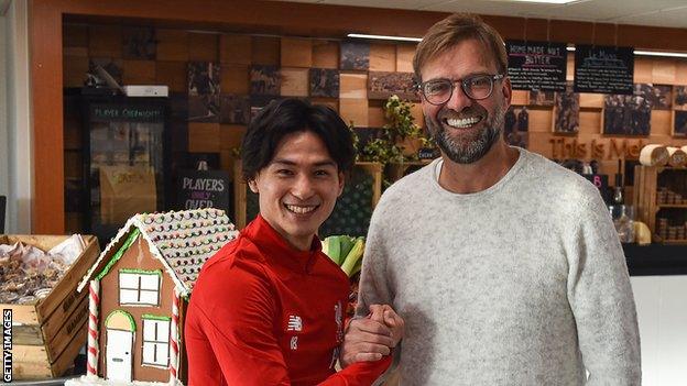 Takumi Minamino and Jurgen Klopp