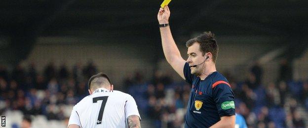 Referee Don Robertson books Hearts winger Jamie Walker